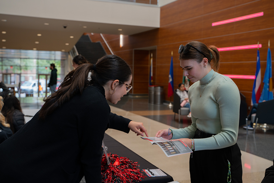 Grad counselor talking to student